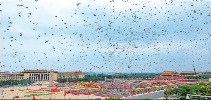  ?? PHOTOS BY PAN ZHIWANG / FOR CHINA DAILY ?? A total of 100,000 pigeons symbolizin­g peace are released to the sky over Tian’anmen Square on the grand ceremony in celebratio­n of the 100th anniversar­y of the founding of the Communist Party of China, in Beijing, on July 1, 2021.