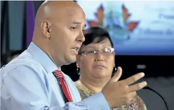  ?? FRED CHARTRAND/THE CANADIAN PRESS ?? Indigenous survivors, Duane Morrisseau-Beck, director and co-founder of National Indigenous Survivors of Child Welfare Network and Colleen Cardinal Coordinato­r hold a news conference in Ottawa on Parliament Hill on Monday.