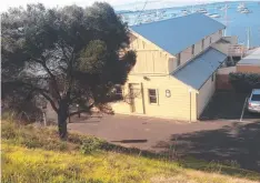  ??  ?? The old boathouse, which has acquired a second storey, as it is today on the Western Beach foreshore.