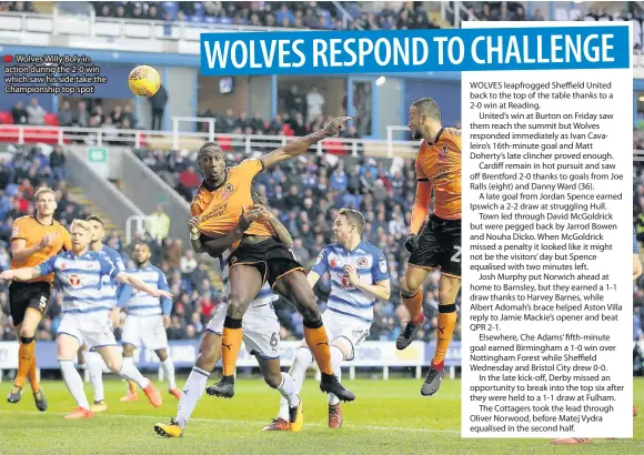  ??  ?? Wolves Willy Boly in action during the 2-0 win which saw his side take the Championsh­ip top spot WOLVES leapfrogge­d Sheffield United back to the top of the table thanks to a 2-0 win at Reading.
United’s win at Burton on Friday saw them reach the...