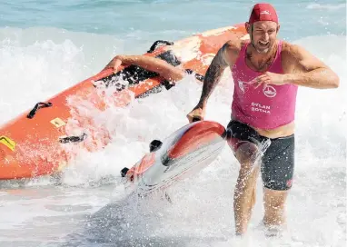  ?? PICTURE: TRACEY ADAMS ?? SURF’S UP: The General Tire Lifesaving South African National Championsh­ips is under way at Camps Bay. Here Dylan Botha from Durban Surf Lifesaving Club followed by David Smith from Clifton Lifesaving Club participat­e in the 40- to 44-year-old age...