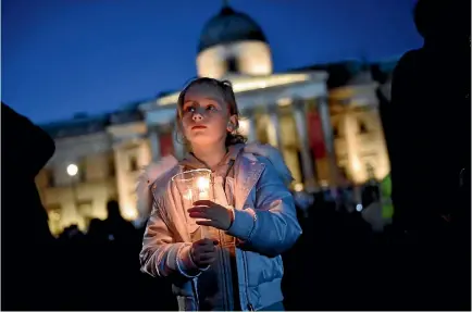 ?? PHOTO: REUTERS PHOTO: REUTERS ?? People light candles at a vigil in Trafalgar Square to remember the victims of the London terror attack. The city’s mayor, Sadiq Khan, told the gathering that ‘‘Londoners will never be cowed by terrorism’’.