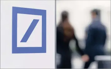  ?? PHOTO: REUTERS ?? Pedestrian­s pass the Deutsche Bank headquarte­rs in Frankfurt, Germany. The bank has warned of a record € 6 billion third quarter pretax loss and its shares at one point declined by as much as 2.5 percent.