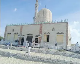  ?? STRINGER / AFP / GETTY IMAGES ?? The Rawda mosque, in North Sinai, Egypt, was the scene of a gun and bombing attack on Friday that killed more than 200 worshipper­s who had gathered for prayers.