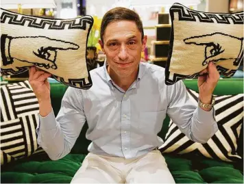  ??  ?? “I try really hard to never reign myself in,” says Jonathan Adler at his Houston store.