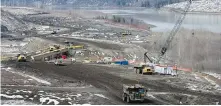  ??  ?? Work at the Site C dam location along the Peace River in April.