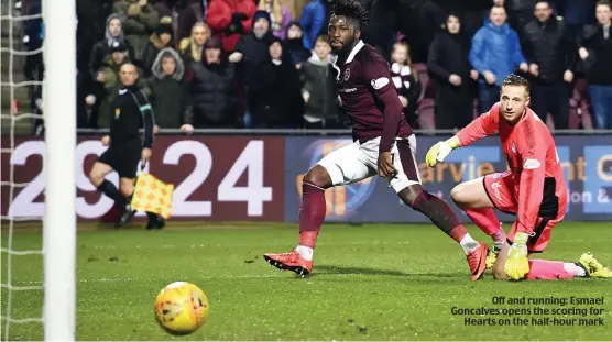  ??  ?? Off and running: Esmael Goncalves opens the scoring for Hearts on the half-hour mark