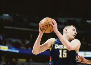  ?? David Zalubowski / Associated Press ?? Denver Nuggets center Nikola Jokic earned his second straight Most Valuable Player award, a person with knowledge of the decision told The Associated Press on Monday.