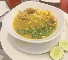  ??  ?? A fish-based delicious soup with rice noodles at Rangon Cafe in Myanmar.