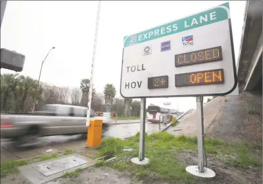  ?? Mayra Beltran / Houston Chronicle ?? HOV Hot Lane access ramp to I45 South in Houston in 2012, where solo drivers willing to pay a fee to get to work or home faster can use the HighOccupa­ncy Toll (HOT) lane on the Gulf Freeway.