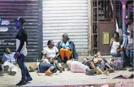  ?? ERIKA SANTELICES/AFP/GETTY IMAGES ?? Migrants wait to ‘regularize’ their immigratio­n status at the Interior Ministry in Santo Domingo, Dominican Republic, before they are rounded up and sent across the border to Haiti.