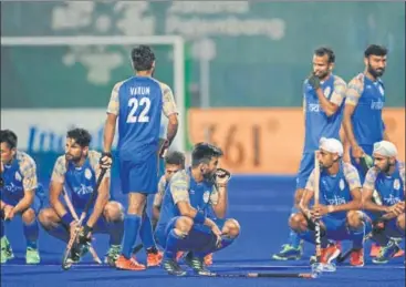  ?? AFP ?? India players look stunned after Malaysia defeated them in their Asian Games hockey semifinal match in Jakarta on Thursday.