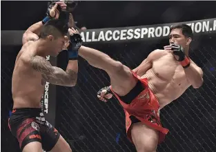  ??  ?? FILIPINO mixed martial arts star Eduard “Landslide” Folayang (R) vows to come back a better fighter after the tough loss he absorbed recently.