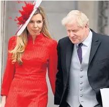  ?? ?? Boris Johnson and wife Carrie leaving the service.