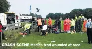  ??  ?? CRASH SCENE Medics tend wounded at race