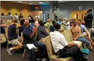  ??  ?? A crowd of nearly 100 people packed Connection­s on High for the first “Pottstown Talks” meeting Monday night. Here, Borough Council Vice President Sheryl Miller, left, addresses the crowd.