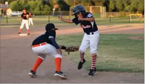  ?? RECORDER PHOTO BY NAYIRAH DOSU ?? Portervill­e All-stars third baseman, Ryan Hernandez, attempts to tag a Visalia runner out during the 10u Little League California District 34 Championsh­ip game, Thursday, June 27, at Divisadero Middle School in Visalia.