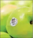  ?? SUBMITTED PHOTO — GIANT FOOD STORES ?? Green apples are on display at the grocery store with an organic seal.