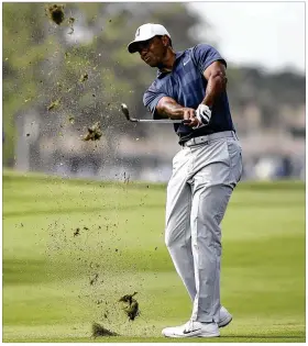  ?? ANDRES LEIVA / PALM BEACH POST ?? Tiger Woods finished 12th in last weekend’s Honda Classic, but his presence helped set an attendance record and boost TV ratings by 43 percent.