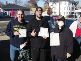  ?? ?? The veterans with their car titles are from left, Bill Ashton of Pawtucket, Seth Guy of Burrillvil­le, and Richard Mandeville of Dartmouth, Mass.