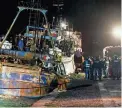  ?? VALERIA FERRARO/AP ?? Police check a boat Saturday in the southern Italian port of Crotone. Italy’s coast guard said it rescued more than 1,000 migrants off the country’s southern mainland in recent days.