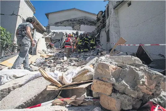  ?? Picture / AP ?? Firefighte­rs search for survivors in the rubble in Accumoli, one of the towns hardest hit by Wednesday’s earthquake.