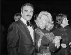  ?? HAROLD FILAN — THE ASSOCIATED PRESS FILE ?? In this file photo, actress Dinah Shore and Burt Reynolds appear together in Los Angeles.