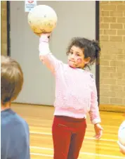  ??  ?? Rosalie Uliando-Dalton practices her netball skills with her group at Bellbird Park.