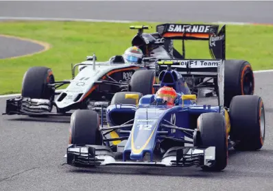  ?? LAPRESSE ?? Felipe Nasr con la Sauber e Sergio Perez con la Force India nel GP Giappone di domenica scorsa: arriverann­o rispettiva­mente 20º e 12º