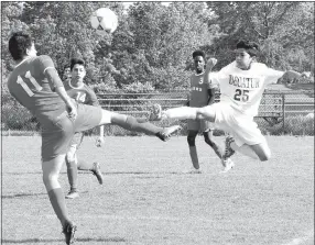  ?? Westside Eagle Observer File Photo/MIKE ECKELS ?? Decatur’s Kelvin Moreno (25) goes toe-to-toe with a Tiger player during the May 5, 2017, Decatur-Dardanelle soccer match at Bulldog Stadium in Decatur. The Bulldogs begin their 2018 season March 6 at home against the Life Way Warriors from Centerton.