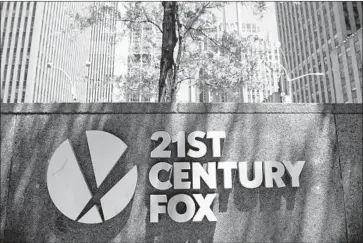  ?? Mark Lennihan Associated Press ?? 21ST CENTURY FOX’S board considered eight regulatory factors before accepting Disney’s revised offer.