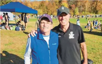  ?? BRENT HAWKINS ?? Litchfield cross country and track coach Brent Hawkins, left, with his friend, Rod Dixon, an Olympian and New York City Marathon winner, are pictured at the Class S cross country championsh­ips at Wickham Park in 2023.