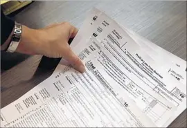  ?? Brennan Linsley Associated Press ?? AMENDING a complex return might require help from a pro, but people with simple tax situations and small changes might be able to amend their own.