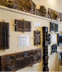  ??  ?? An early 17th century lion head frieze is displayed above elaborate wood carvings at Saffron Walden’s museum.