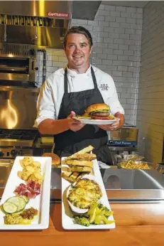  ?? STAFF FILE PHOTO BY TIM BARBER ?? Charlie Loomis, executive chef and partner at the Feed Company Table & Tavern, will defend his Cast Iron Cook-Off title at Chattanoog­a Market on Sunday, Sept. 18.