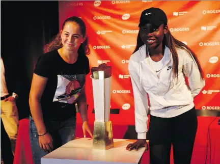  ?? JACK BOLAND ?? French Open champ Jelena Ostapenko, left, and Canadian Francoise Abanda are both 20 and came up the tennis ranks together.