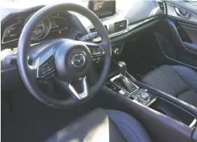  ?? AFF PHOTO BY MARK KENNEDY ?? The 2018 Mazda3 five-door has a functional but slightly dated interior.