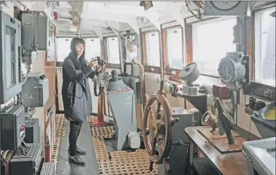  ?? PICTURE: TONY JOHNSON. ?? REMINDER: Volunteer Pauline Barlow makes a photograph­ic record of artefacts in the wheelhouse on the Arctic Corsair.