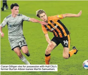  ??  ?? Ciaran Gilligan vies for possession with Hull City’s former Burton Albion loanee Martin Samuelsen.