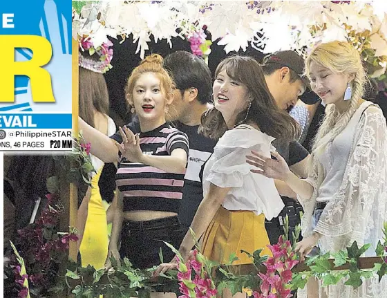  ??  ?? Members of the K-Pop girl group Momoland join the Feria de Candon electric float parade in Ilocos Sur on Saturday night. The group was set to hold a free mini-concert, sponsored by the provincial government, in Vigan last night. ANDY ZAPATA JR.