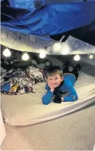  ??  ?? Camped in Finlay shows off his bedroom den