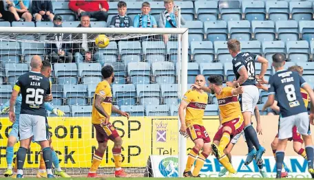  ??  ?? Lee Ashcroft gets above the Well defence to head home the only goal