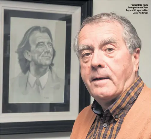  ??  ?? Former BBC Radio Ulster presenter Sean Coyle with a portrait of
Gerry Anderson