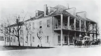  ?? Courtesy / Houston Public LIbrary ?? In 1837, Houston became the capital of the fledgling Republic of Texas. This photograph, date unknown, shows the capitol building, built on the downtown site now occupied by the Post Rice Lofts.