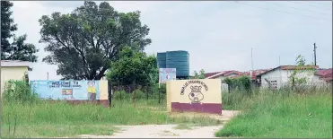  ?? ?? The house from which the deceased was fetched. (R) A view of Dwalile Primary School, where the mob allegedly met the day before the assualt took place.