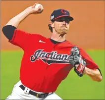  ?? Associated Press photo ?? In this Sept. 29 file photo, Cleveland Indians starting pitcher Shane Bieber delivers in the first inning of Game 1 of an American League wild-card baseball series against the New York Yankees in Cleveland. Bieber was named Wednesday as winner of the American League Cy Young Award.