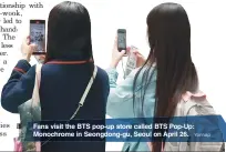  ?? Yonhap ?? Fans visit the BTS pop-up store called BTS Pop-Up: Monochrome in Seongdong-gu, Seoul on April 26.