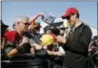  ?? RICK SCUTERI - AP ?? Joey Logano signs autographs before a NASCAR Cup Series auto race in Avondale, Ariz. Logano is the outsider competing for the NASCAR championsh­ip Sunday.