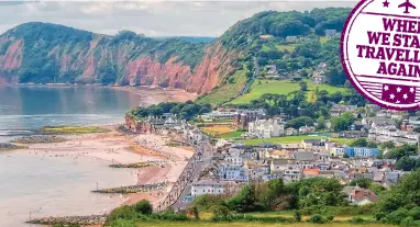  ??  ?? Golden sands: The sedate town of Sidmouth on the Jurassic Coast has history aplenty