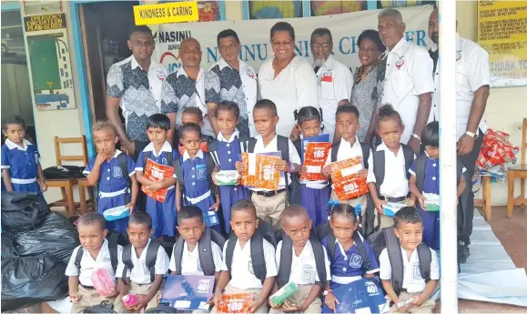  ??  ?? Nasinu Junior Chamber members with teachers and students during the distributi­on of stationery and bags at Qalitu District School in Cakaudrove on January 19, 2021.